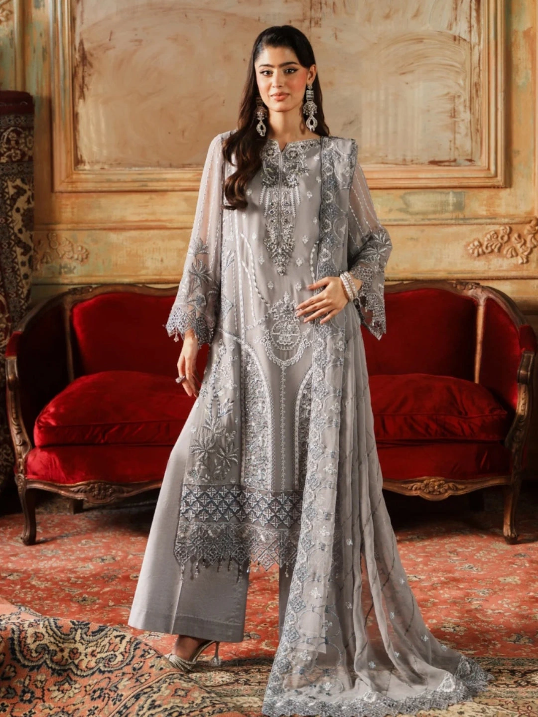 Grey kameez with silver embroidery and a sheer chiffon dupatta, modelled in an ornate vintage interior